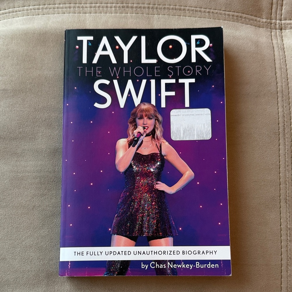 Taylor Swift: The Whole Story - paperback Biography (Purple Cover)